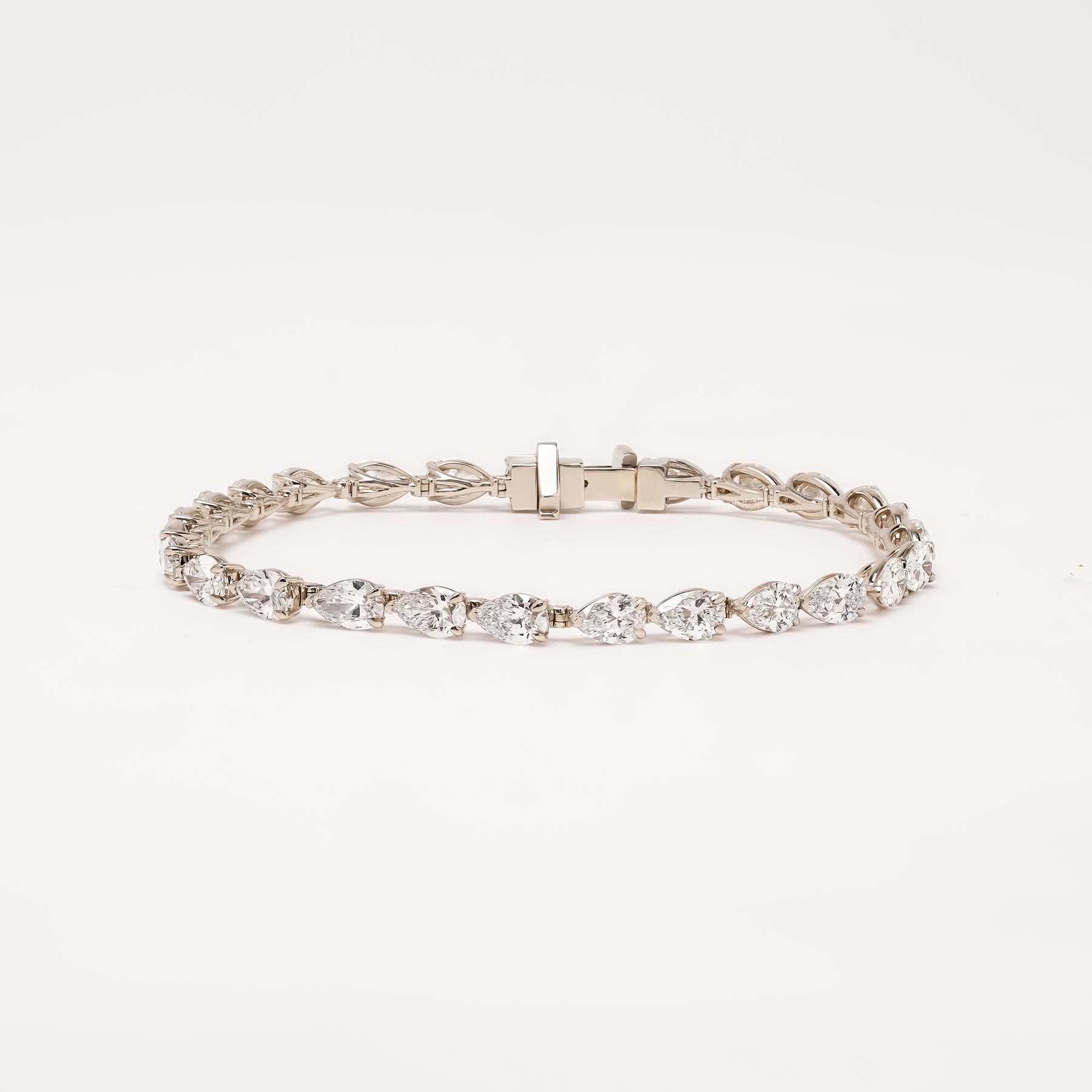 Caliane pear lab grown diamond tennis bracelet on white background