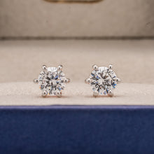 Front view of round lab grown diamond stud earrings inside Ronora box