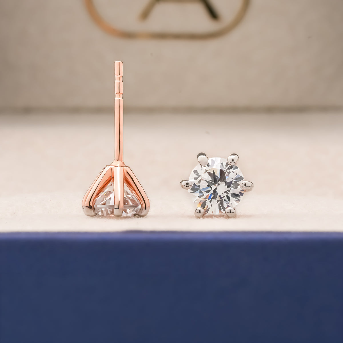 Side and front view of round lab grown diamond stud earrings with post backs