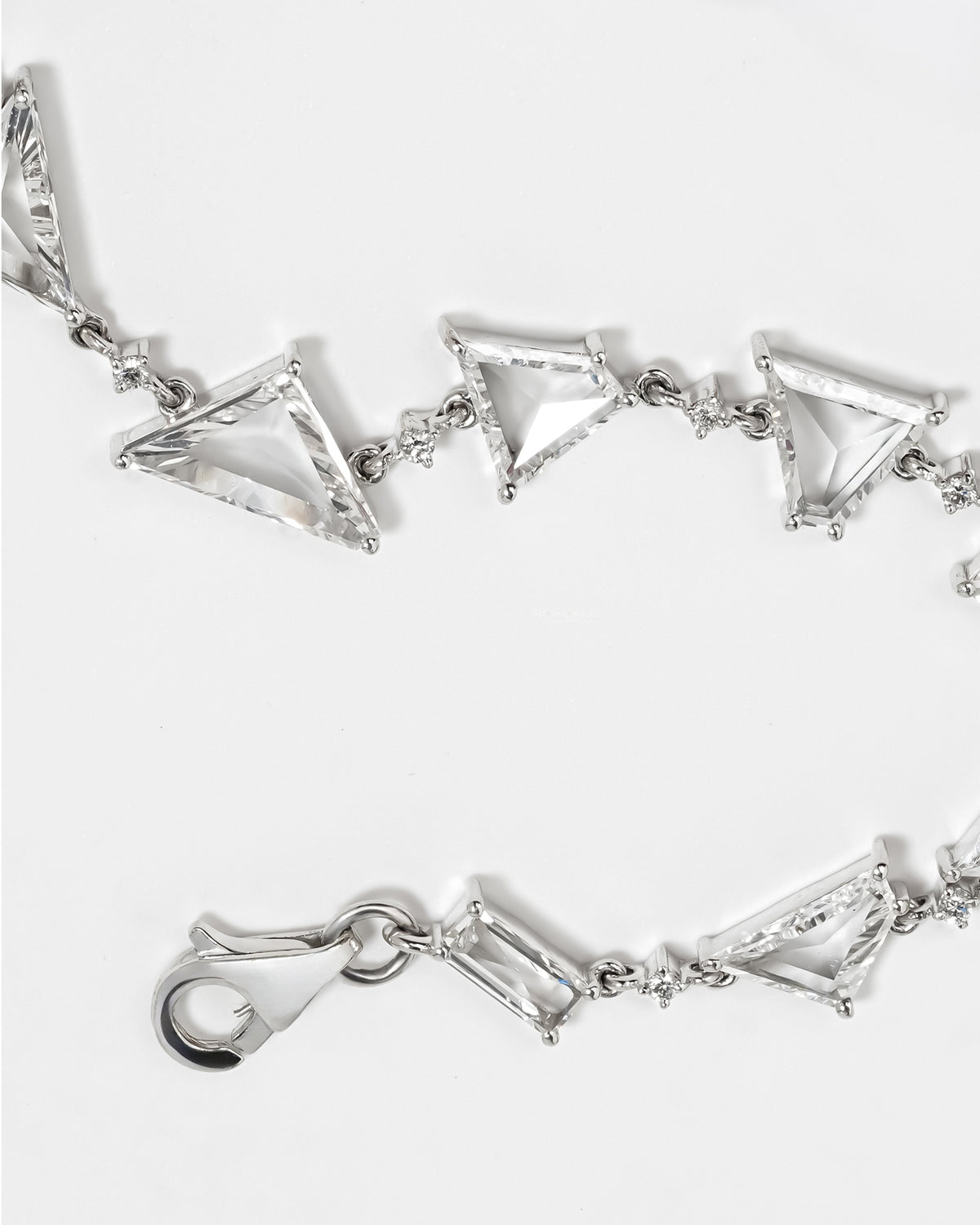 Multi shape lab grown diamond bracelet open showing the clasp and link pattern