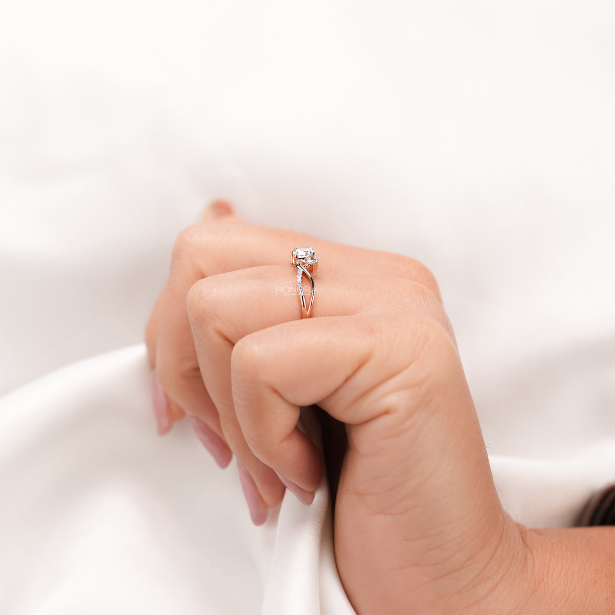 Side profile of round lab grown diamond bypass ring showing ring setting