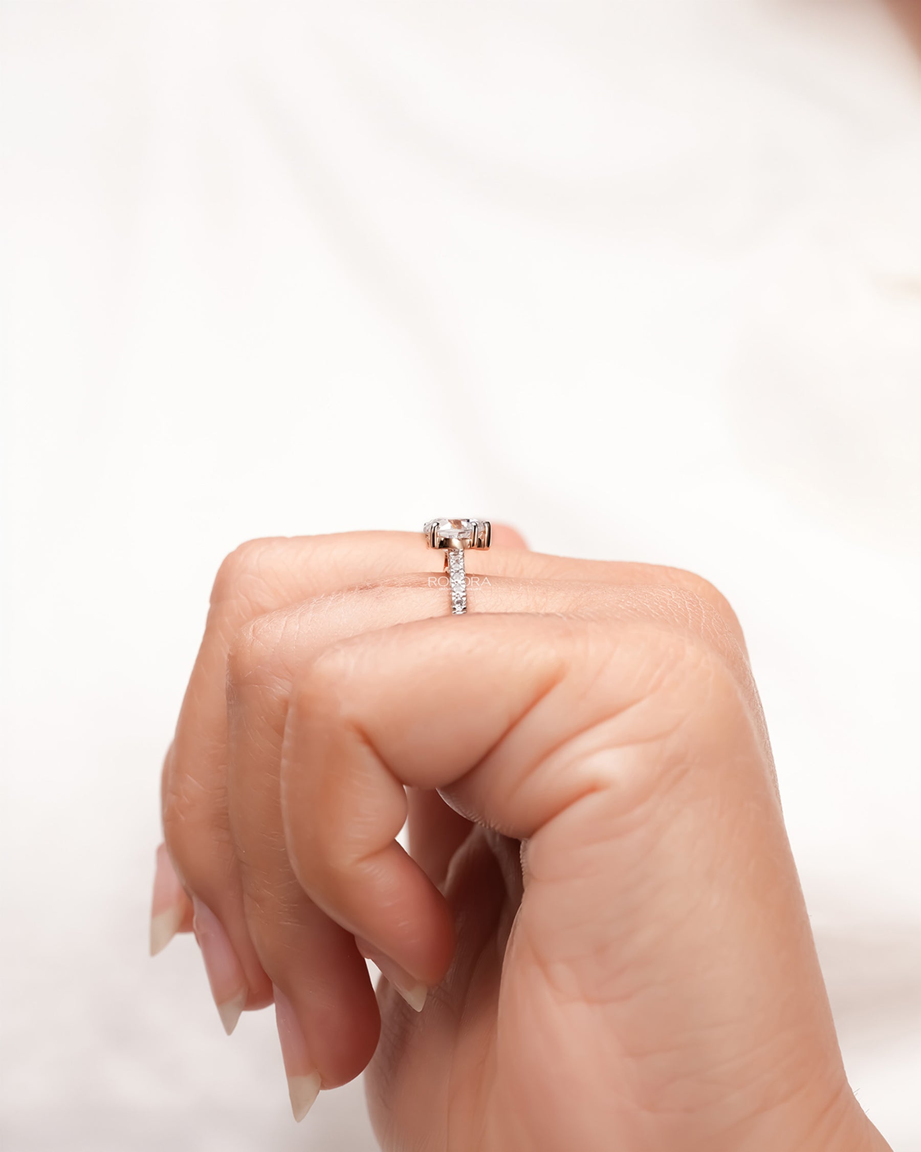 heart moissanite pave ring worn with luxury styling in rose gold