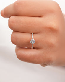 Side profile of round moissanite pave ring showing ring setting