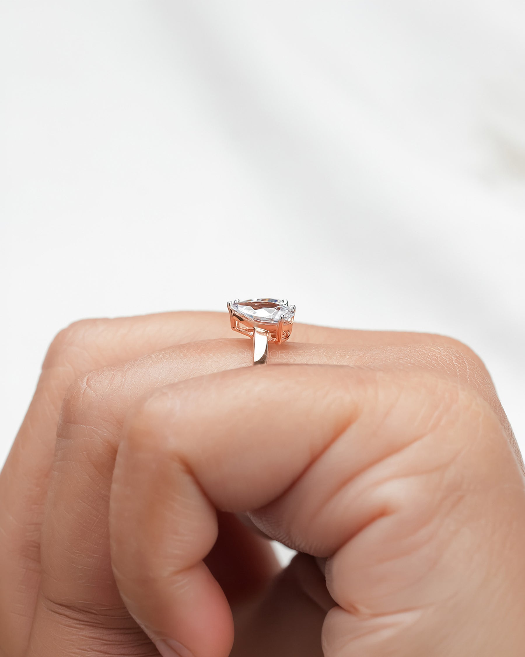 heart pear moissanite toi et moi ring worn with luxury styling in rose gold