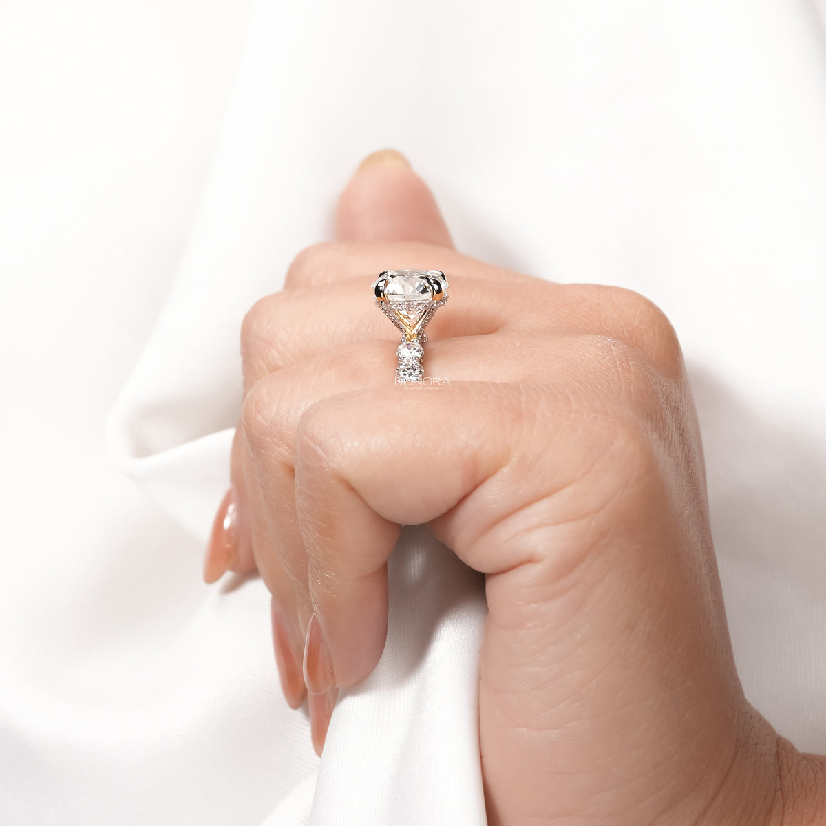 Side profile of round lab grown diamond vintage halo ring showing ring setting