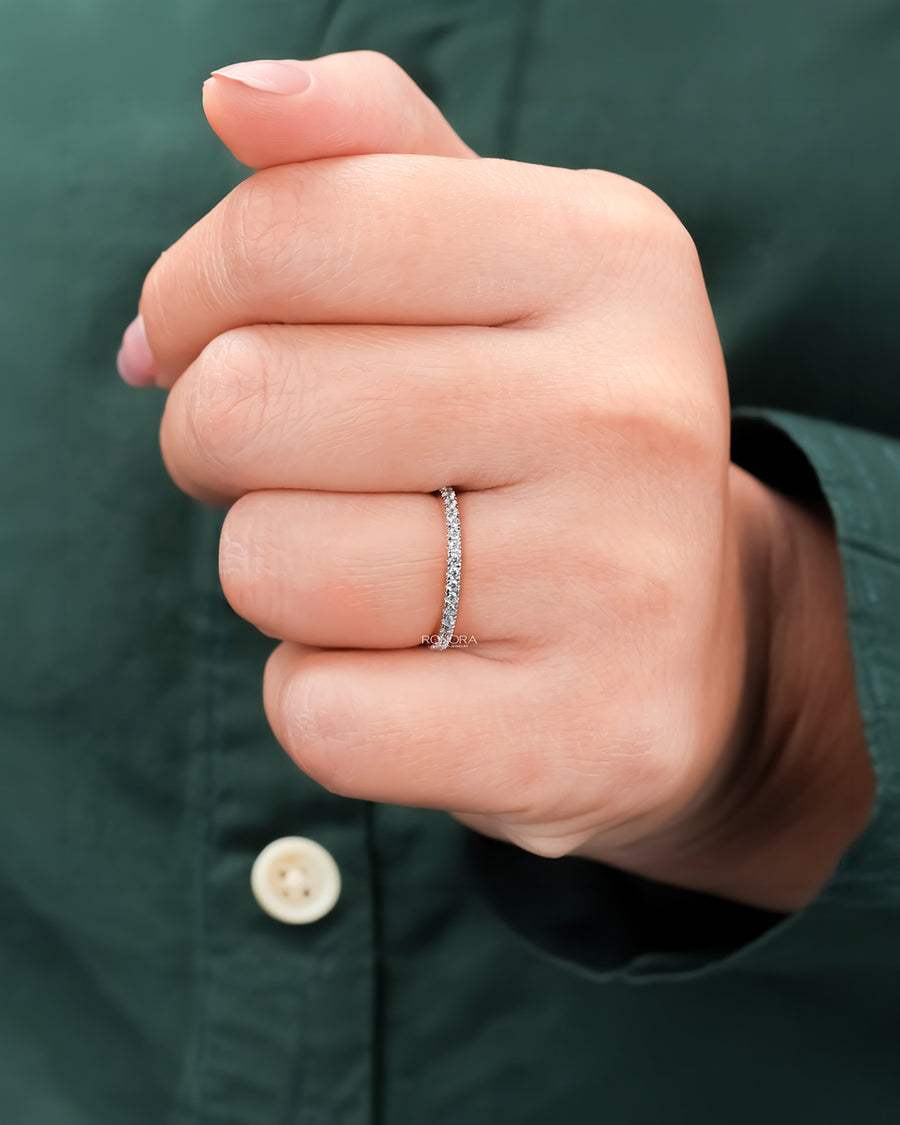 Slim curved lab grown diamond pavé band worn on hand in rose gold