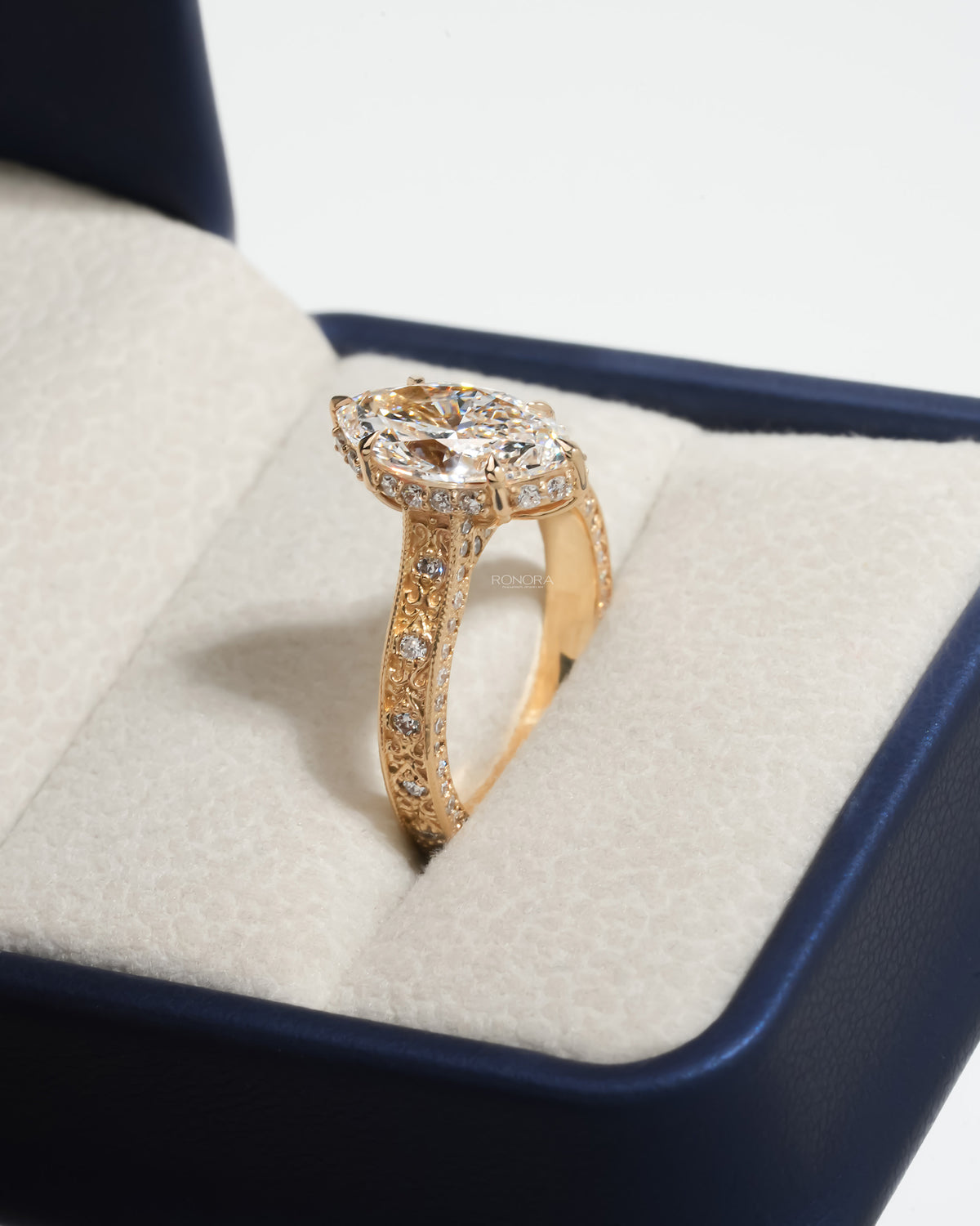 Vintage marquise lab grown diamond ring angled in a Ronora ring box