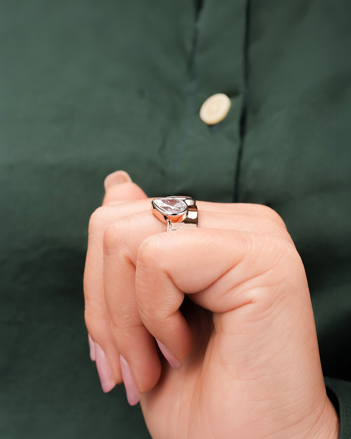 pear lab grown diamond bypass ring worn with luxury styling in rose gold