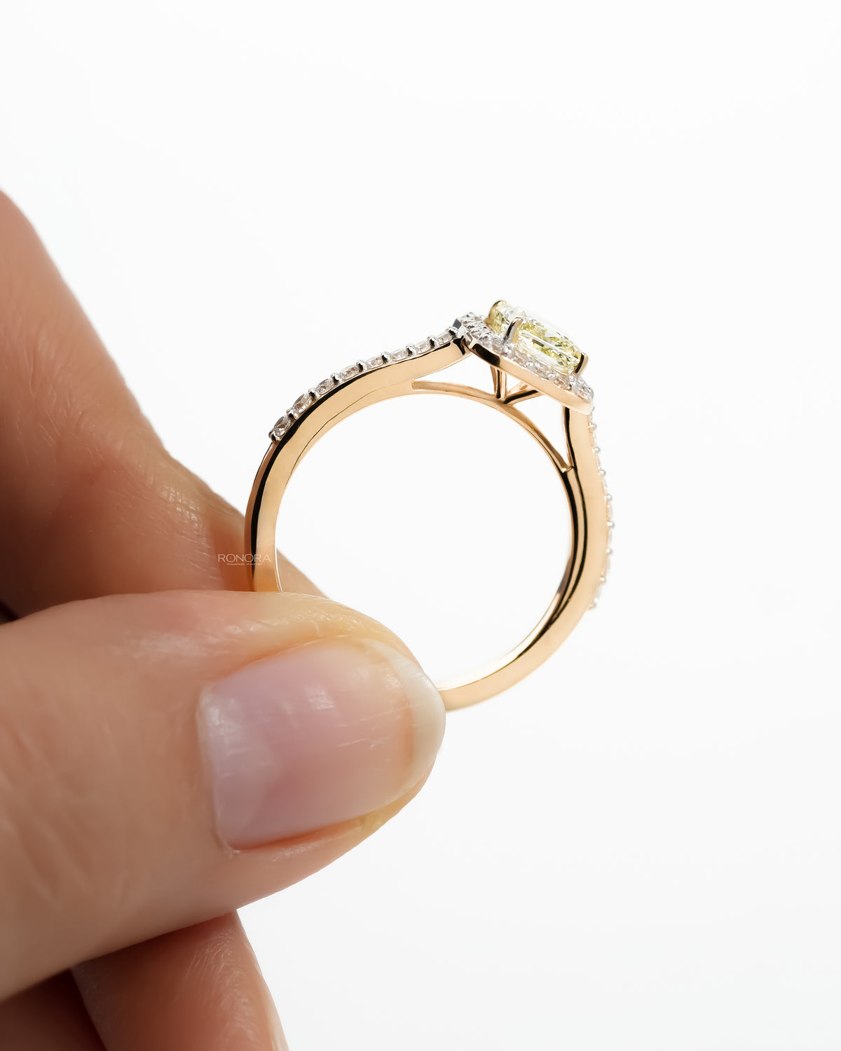 Side profile of the fancy yellow lab grown diamond halo ring showing the pave band
