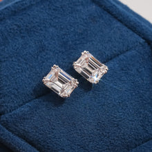 Elise emerald lab grown diamond stud earrings on blue velvet