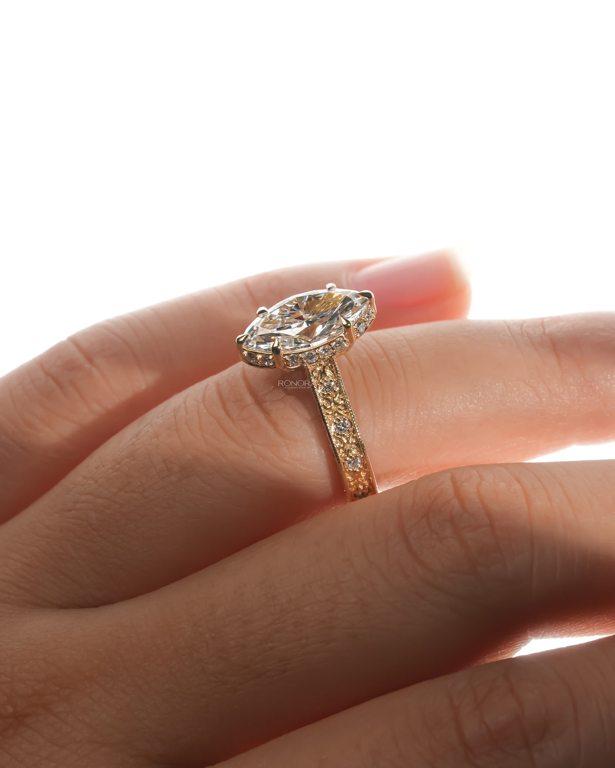 Vintage marquise lab grown diamond ring worn on the hand from the side