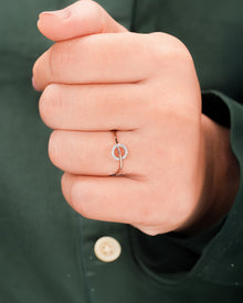 Round lab grown diamond bypass ring worn on hand in rose gold