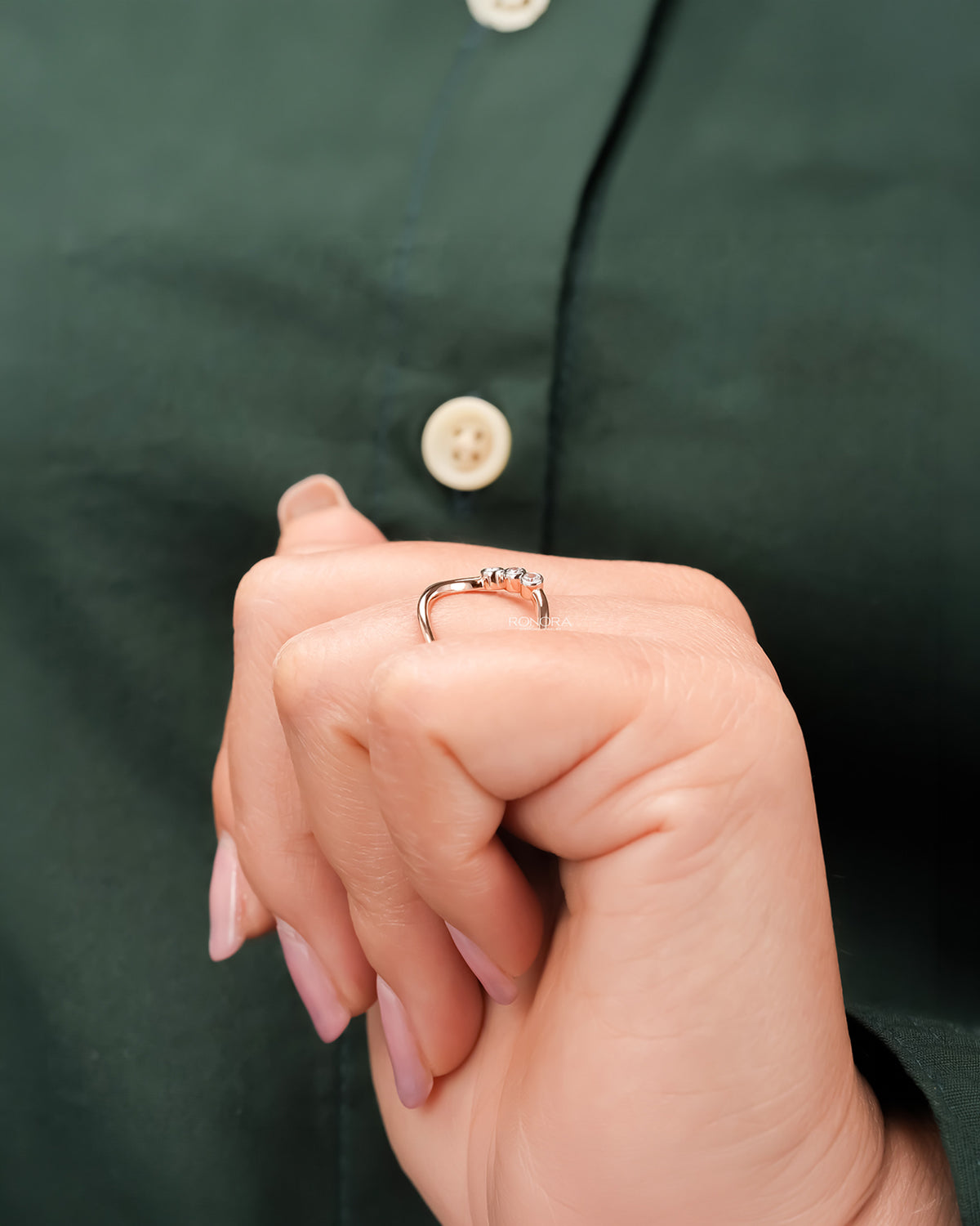 Open lab grown diamond swirl ring worn with white silk