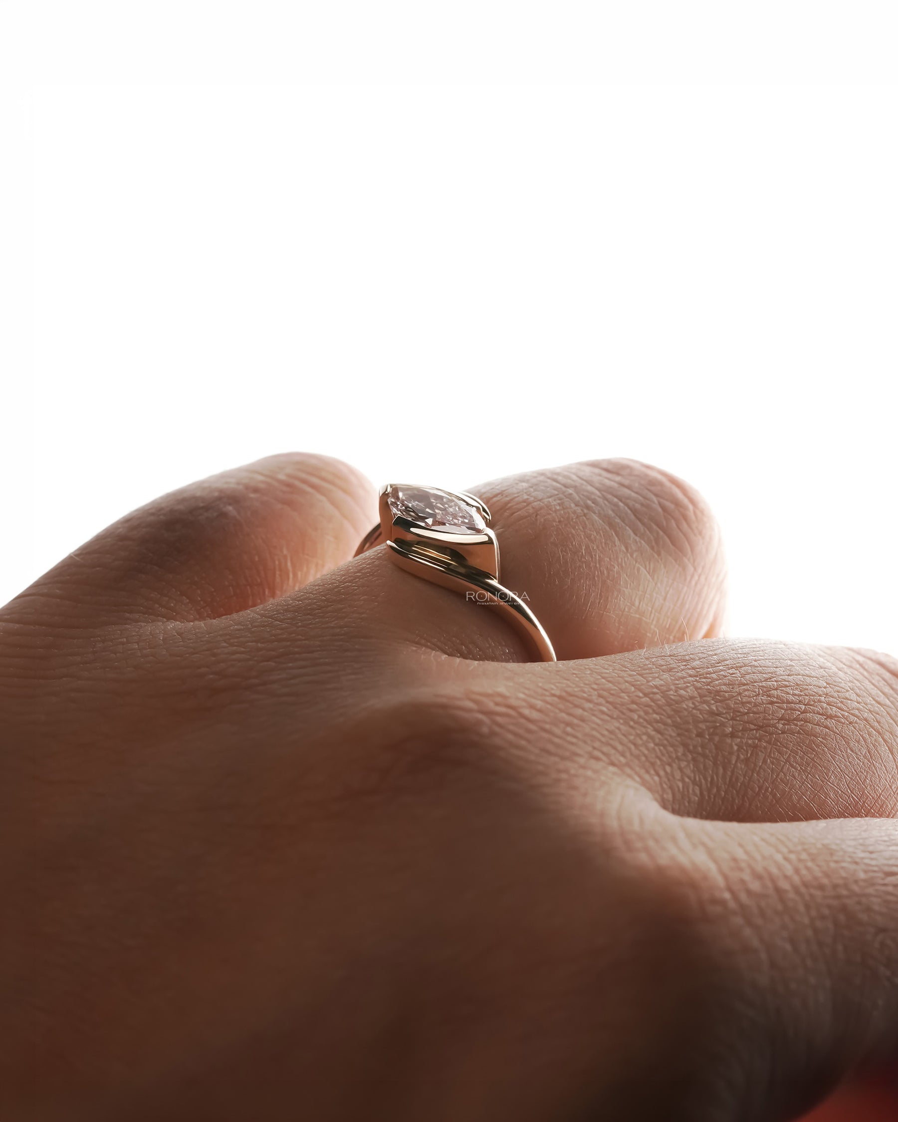 Back view of pink marquise lab grown diamond twist ring showing band detail