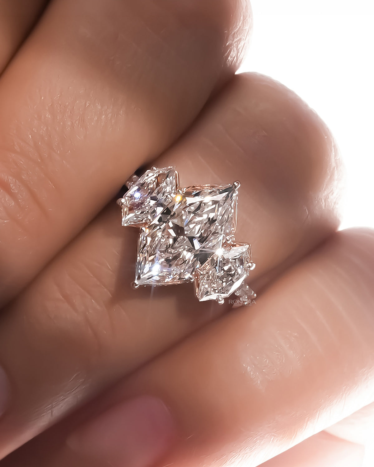 marquise lab grown diamond three-stone ring worn on hand in white gold