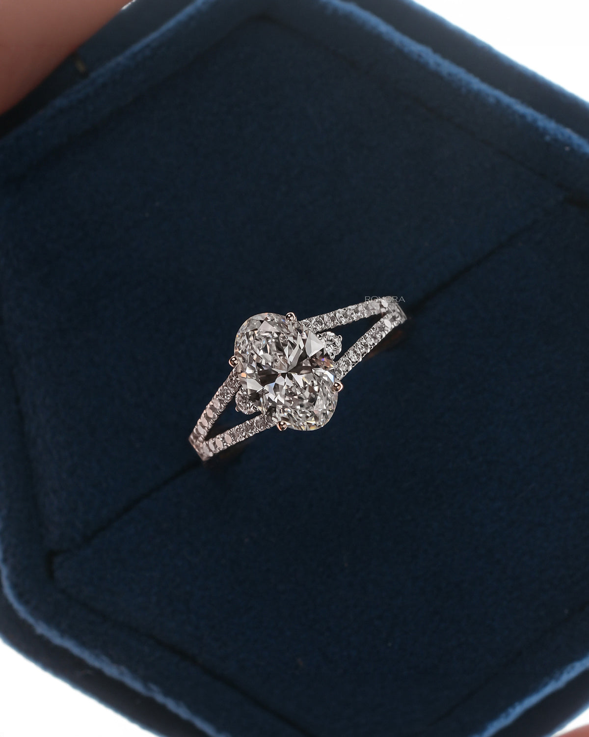 Florence oval lab grown diamond halo ring in white gold inside Ronora box