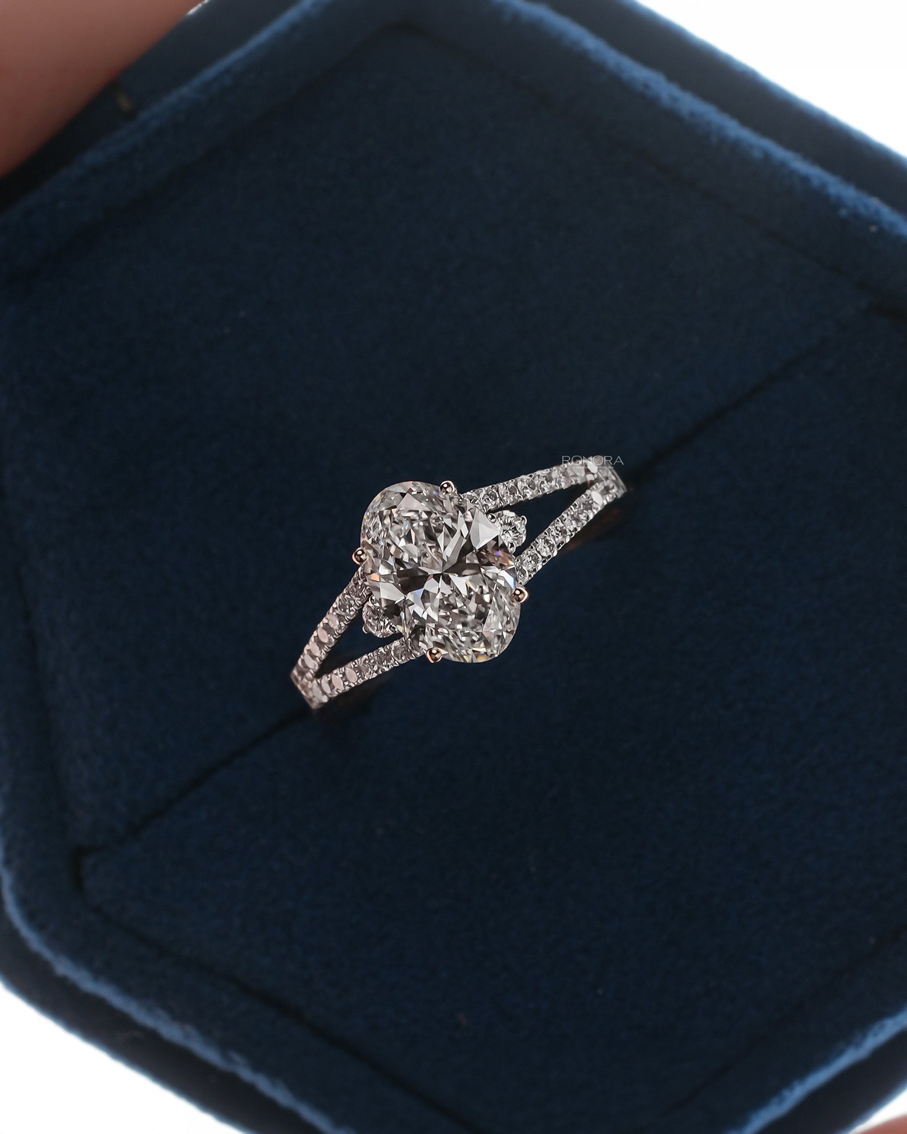 Florence oval lab grown diamond halo ring in white gold inside Ronora box