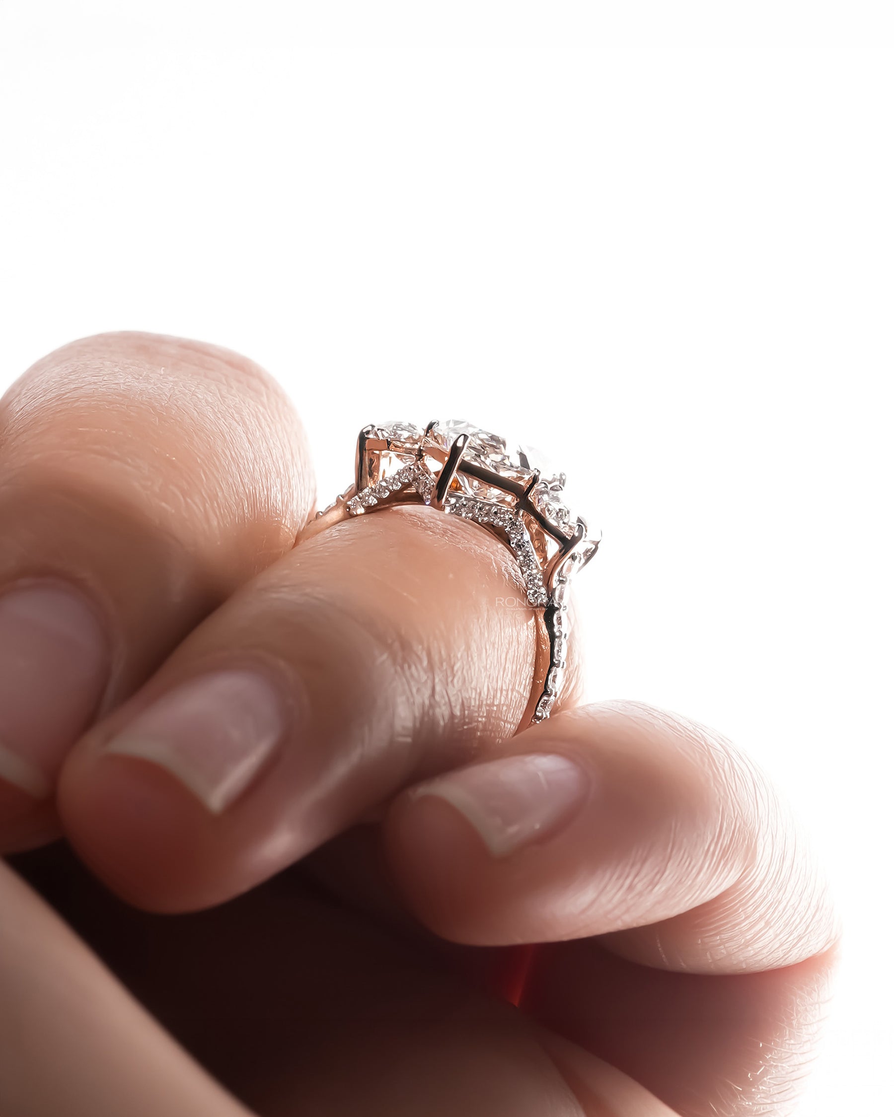 Detail view of marquise lab grown diamond three-stone ring in white gold