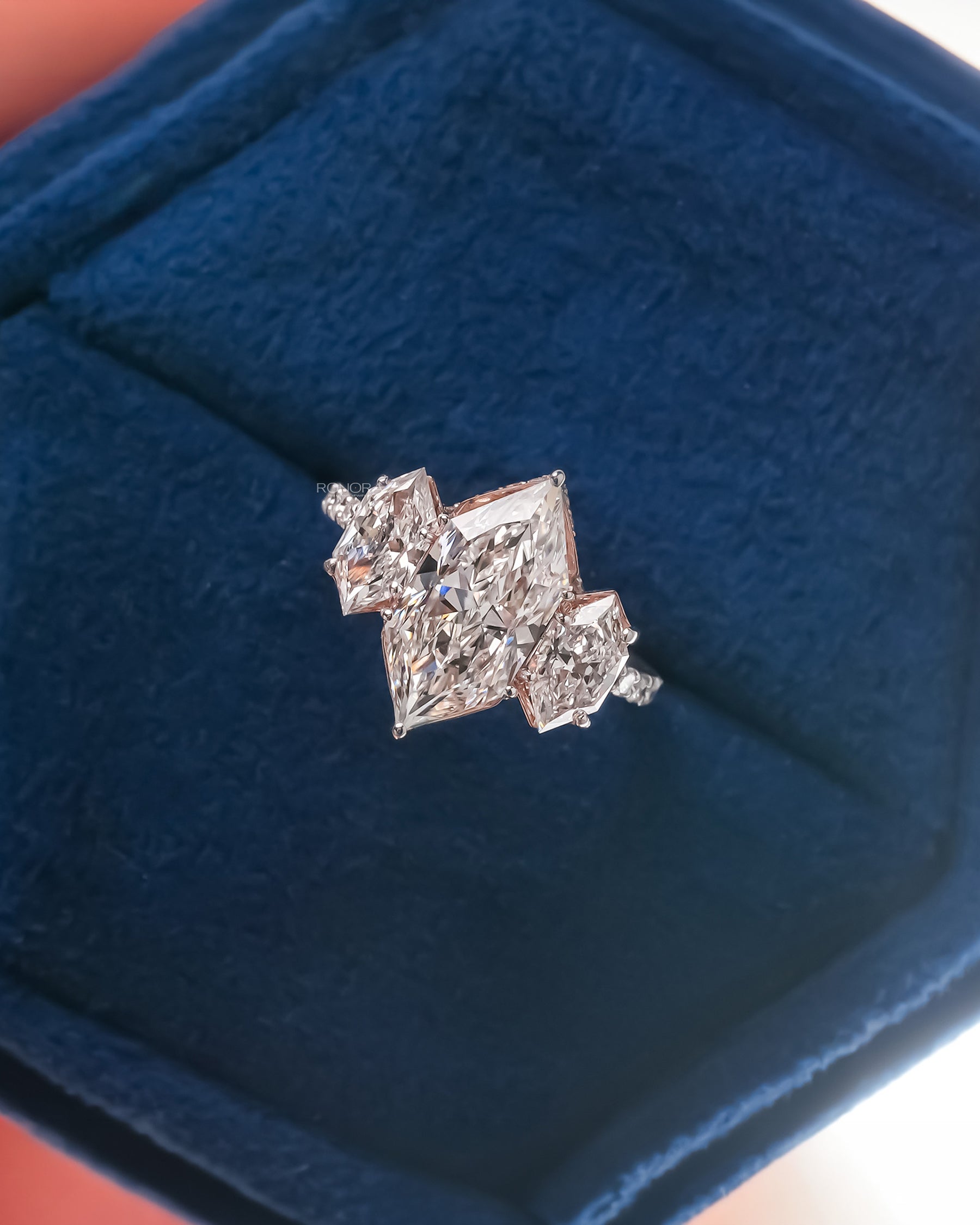 Cassandra marquise lab grown diamond three-stone ring in white gold inside Ronora box