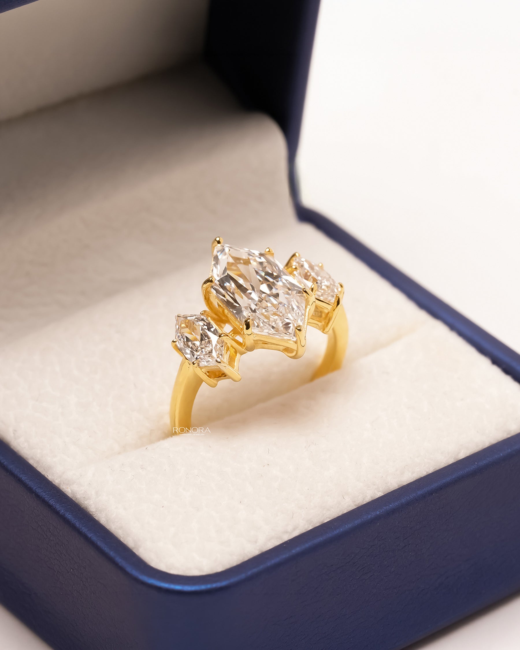 Yellow gold marquise three-stone lab grown diamond ring in Ronora box