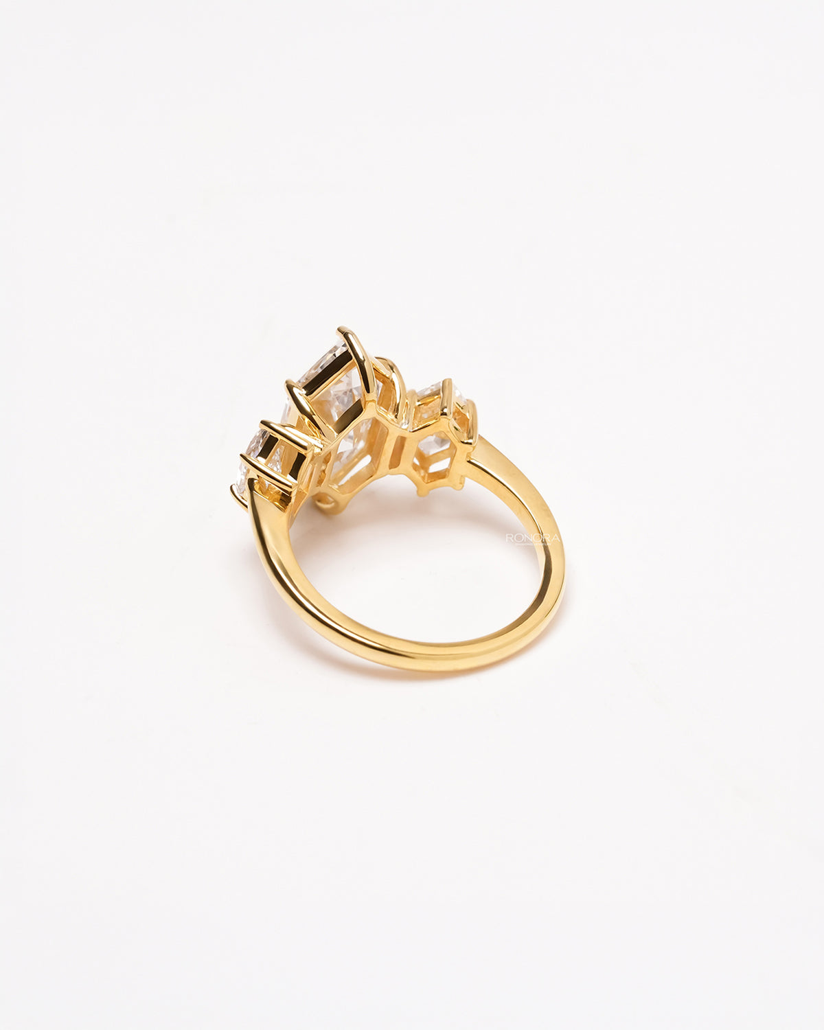 Back view of marquise lab grown diamond three-stone ring showing side-stone setting