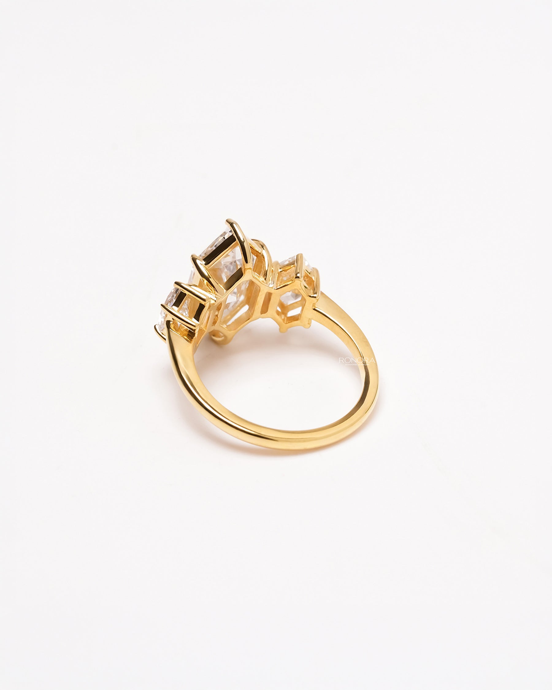Back view of marquise lab grown diamond three-stone ring showing side-stone setting