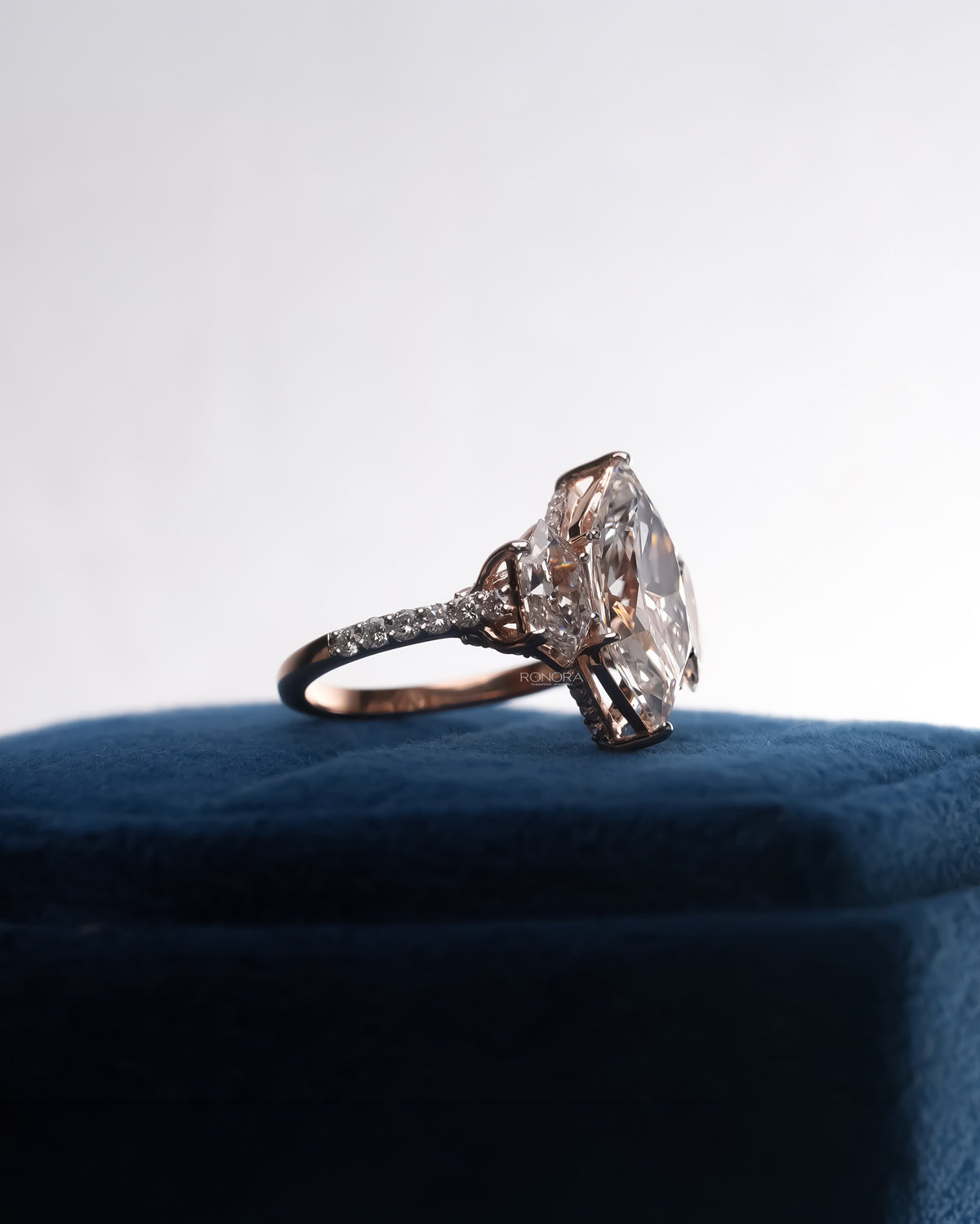 Back view of marquise lab grown diamond three-stone ring showing band detail
