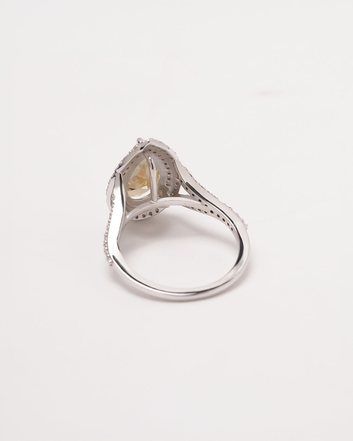 Back view of yellow pear lab grown diamond halo ring showing band and gallery detail