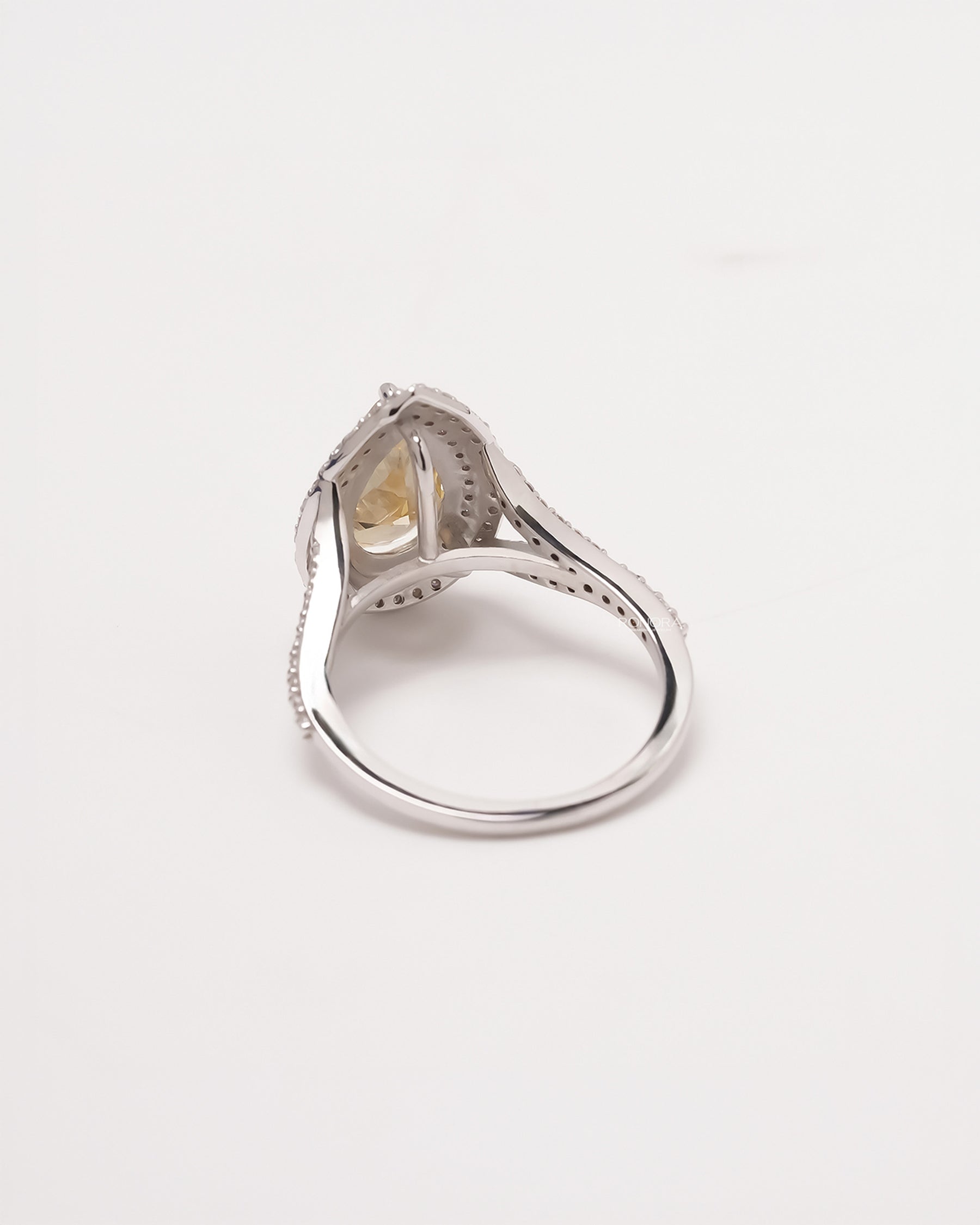 Back view of yellow pear lab grown diamond halo ring showing band and gallery detail