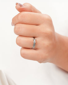 Round lab grown diamond five-stone band worn on hand in white metal