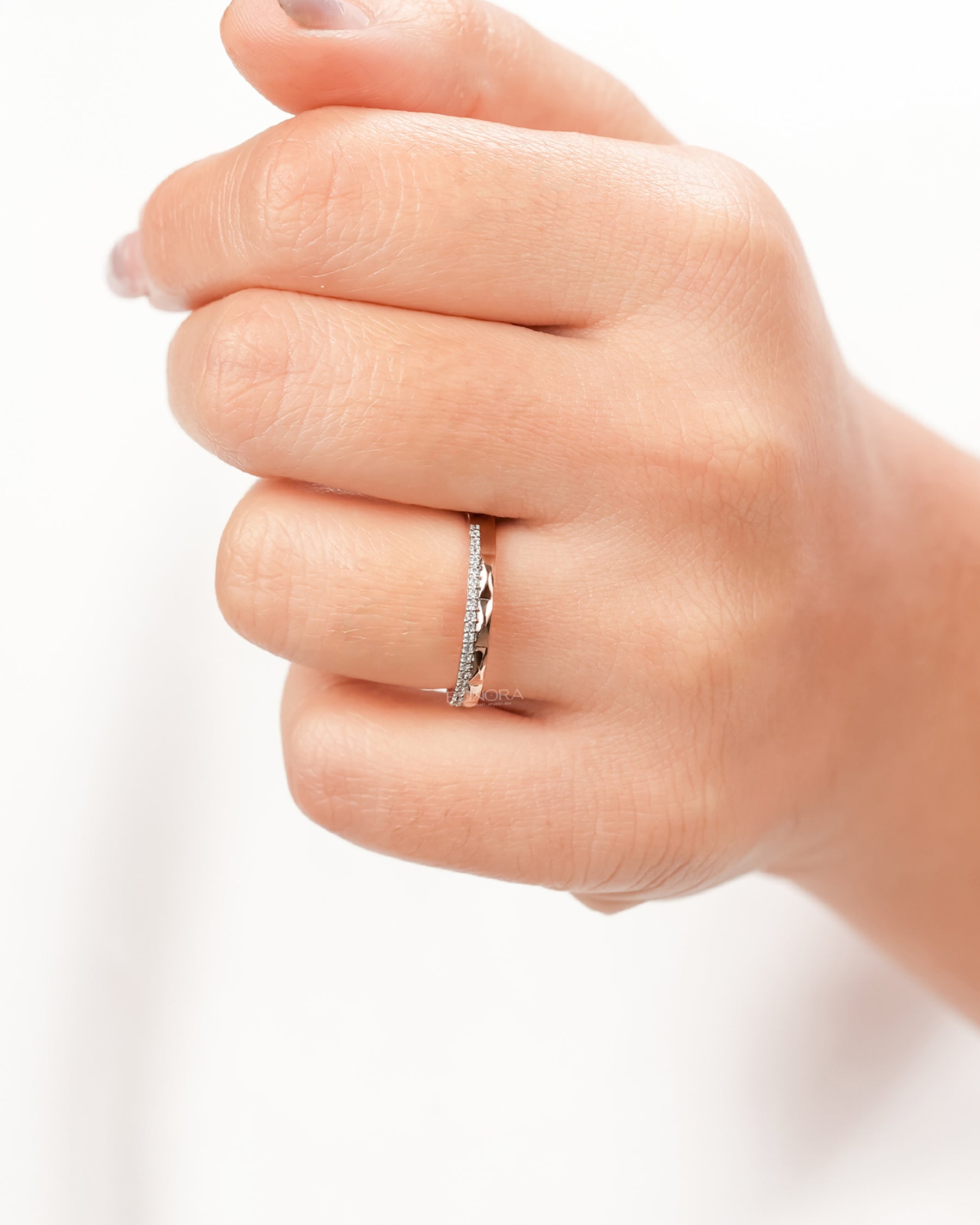 Split lab grown diamond pavé band worn on hand in rose gold