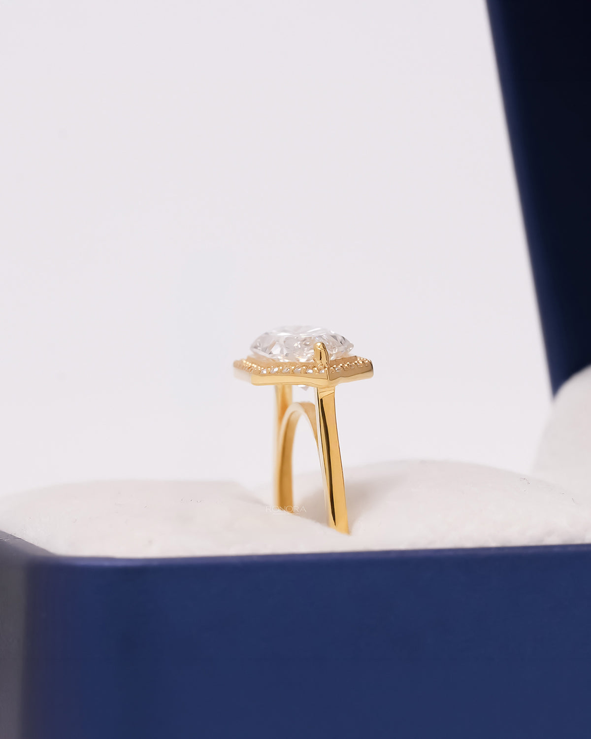 Side profile of marquise lab grown diamond halo ring showing split shank