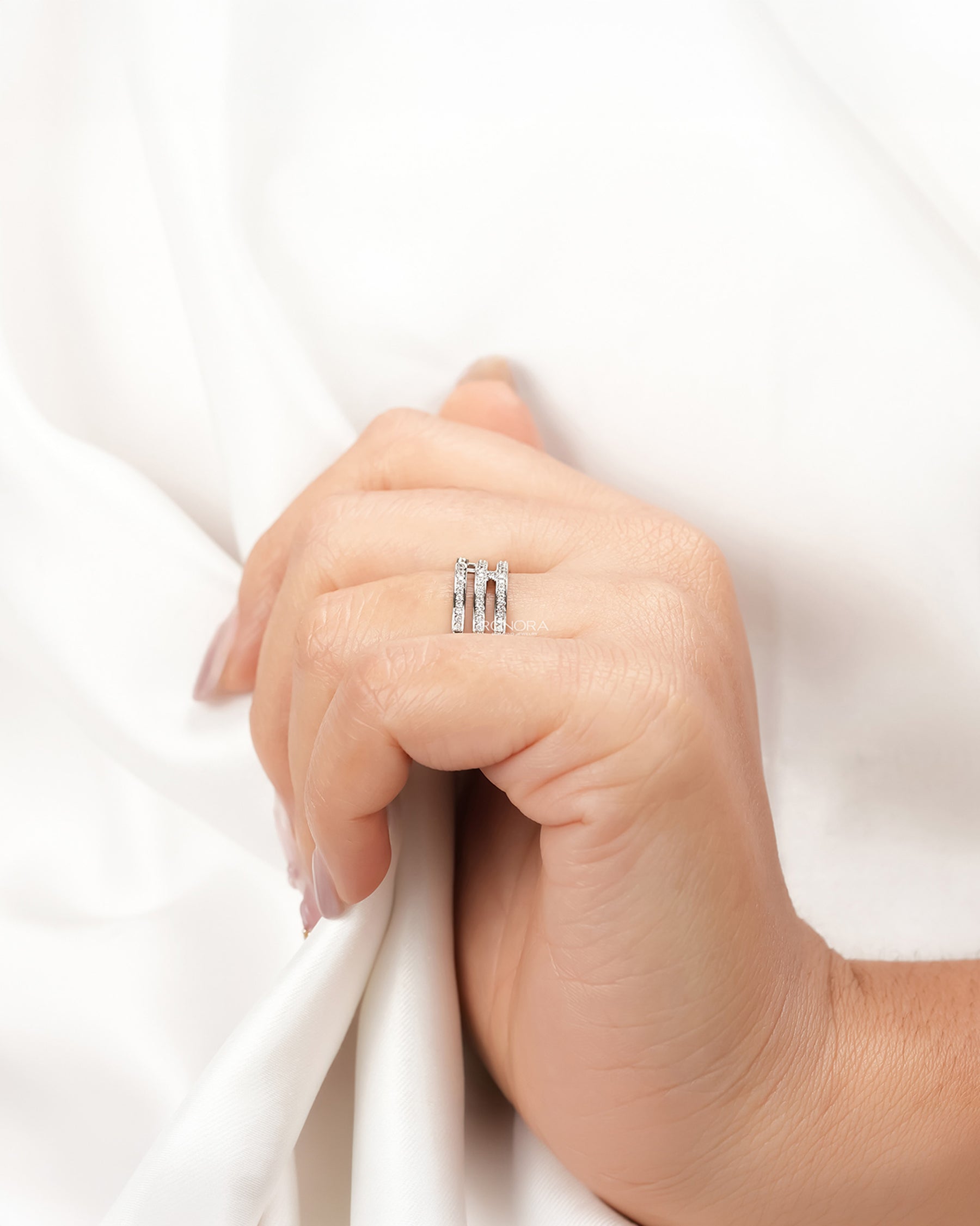 Wide lab grown diamond pavé band worn with white silk