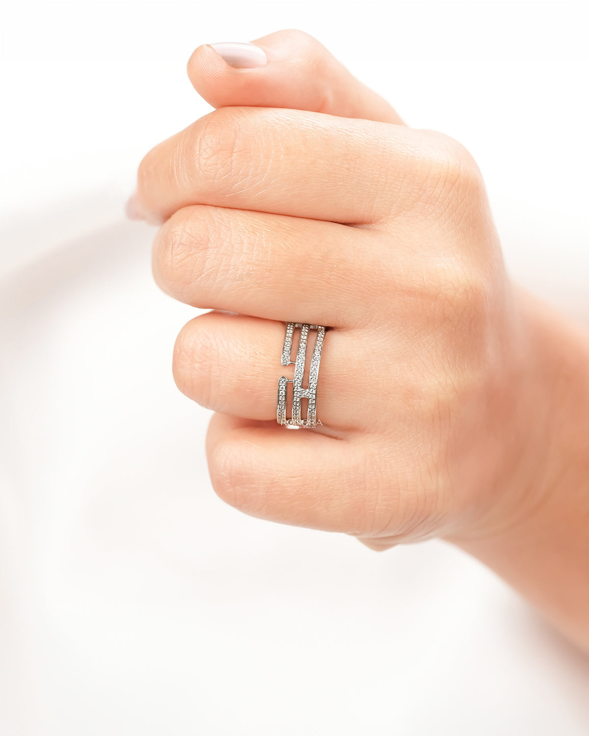 Wide lab grown diamond pavé band worn on hand in white metal