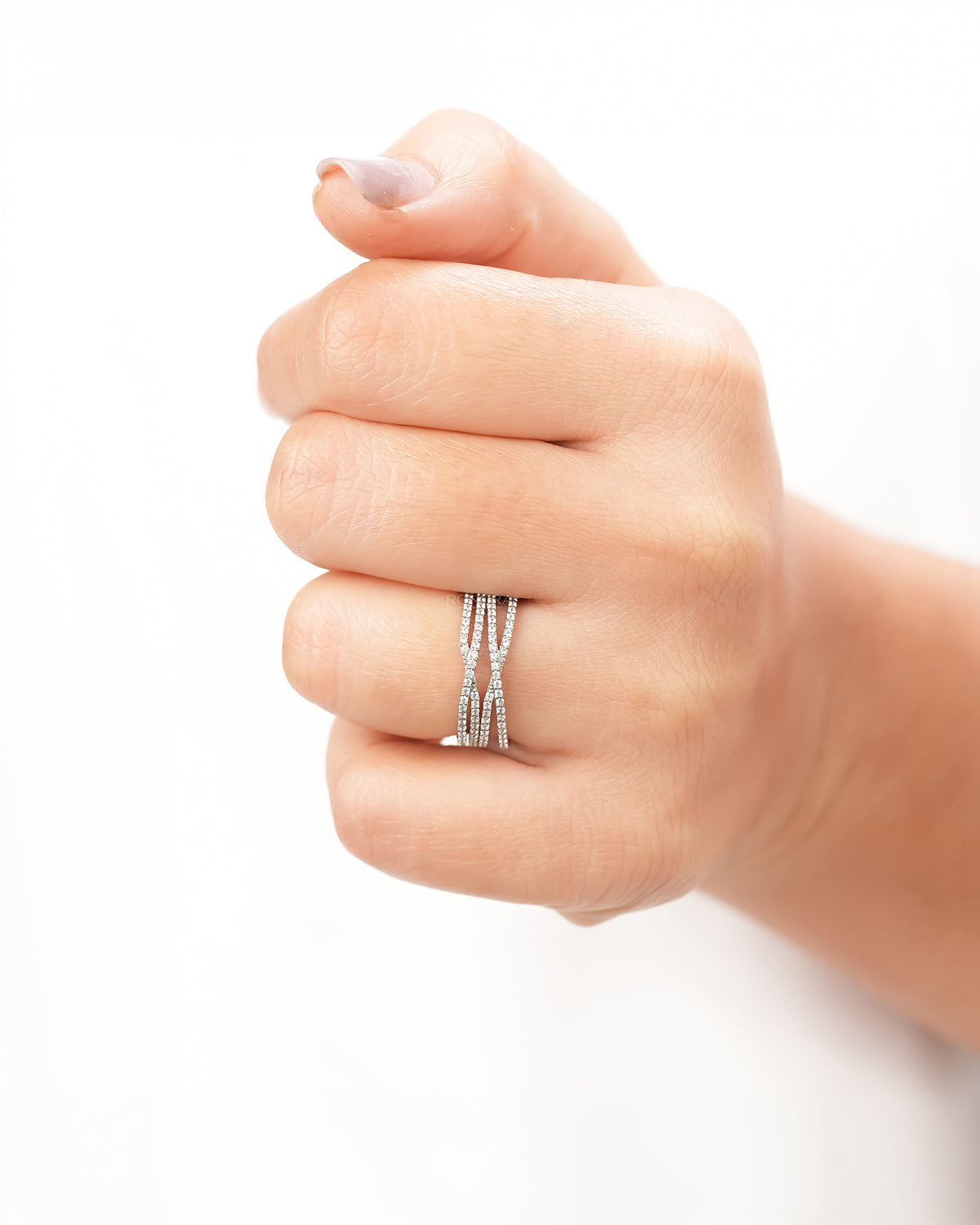 Four-band lab grown diamond pavé crossover ring worn on hand