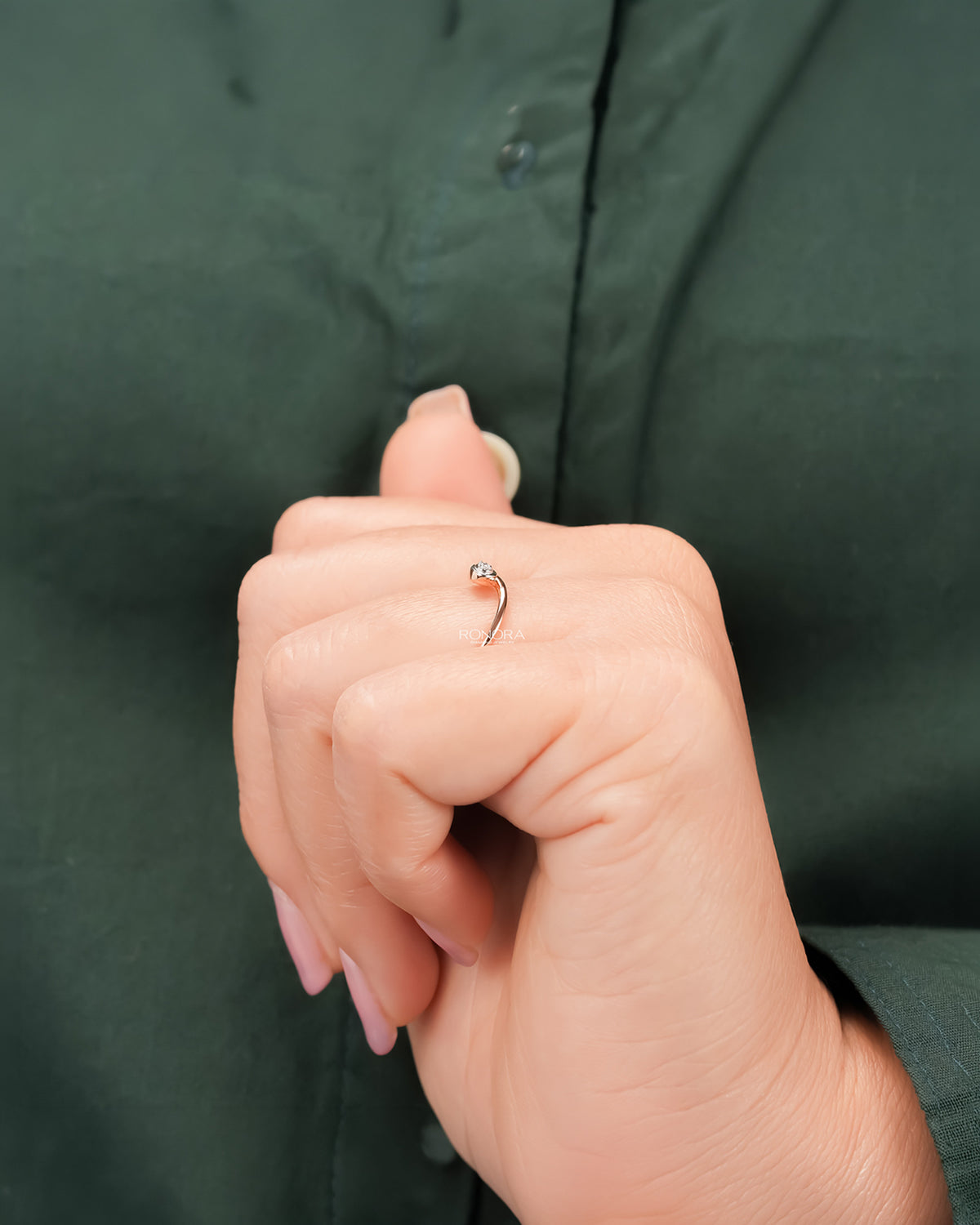 round lab grown diamond solitaire ring worn with luxury styling in rose gold