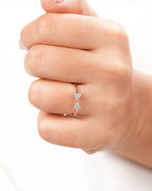 Pavé bow lab grown diamond ring worn on hand in rose gold