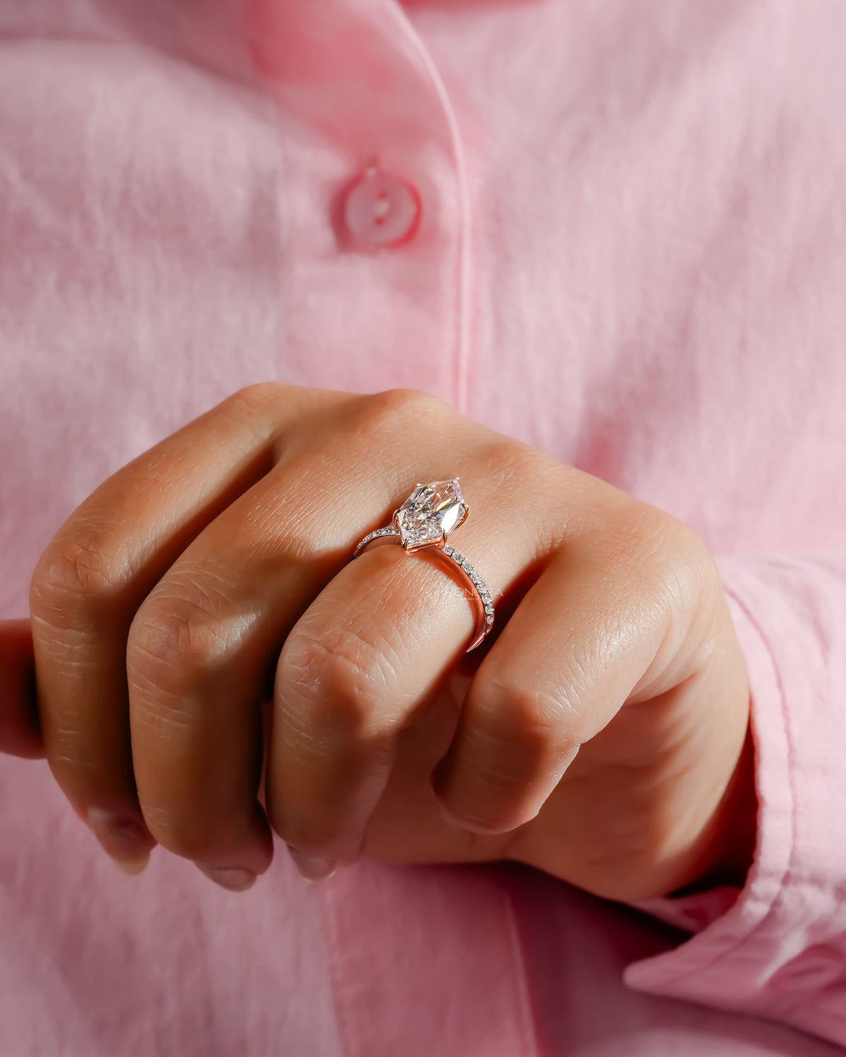 marquise lab grown diamond solitaire ring worn with luxury styling in white gold