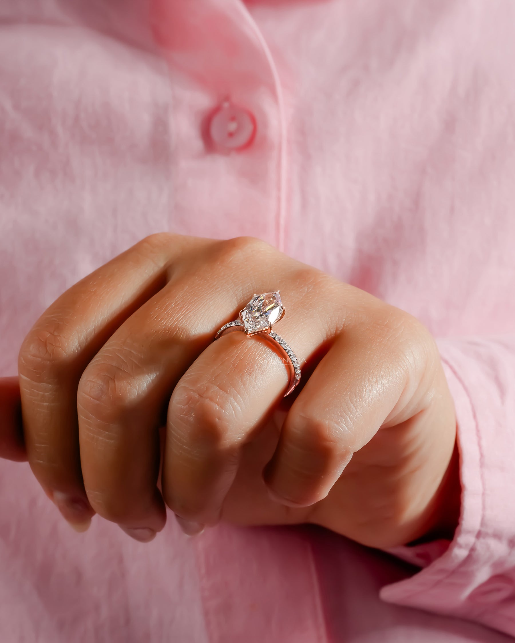 marquise lab grown diamond solitaire ring worn with luxury styling in white gold