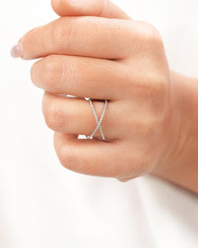 White lab grown diamond crossover ring worn on hand