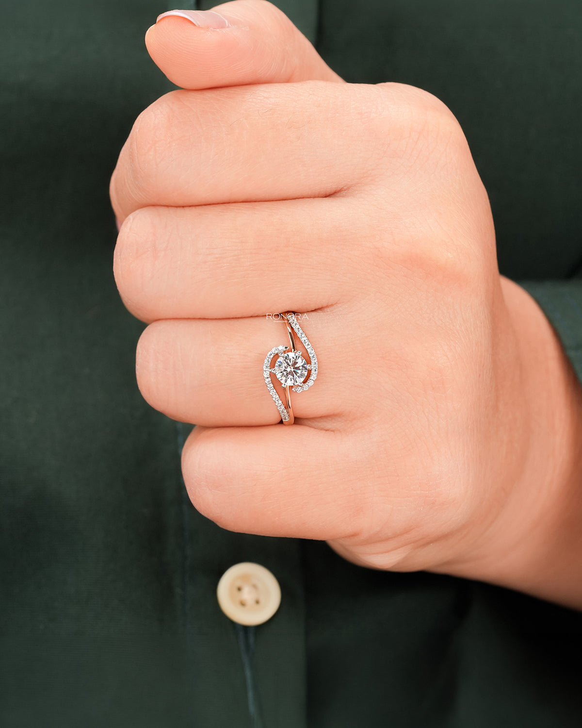Round lab grown diamond twisted pavé ring worn on hand in rose gold