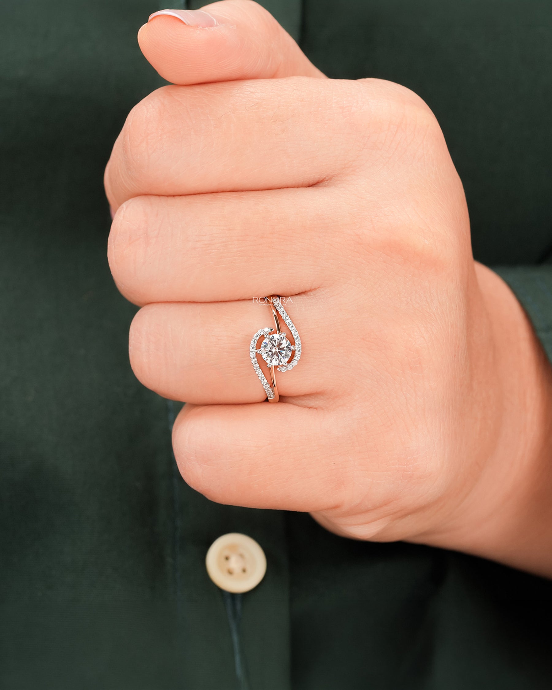 Round lab grown diamond twisted pavé ring worn on hand in rose gold