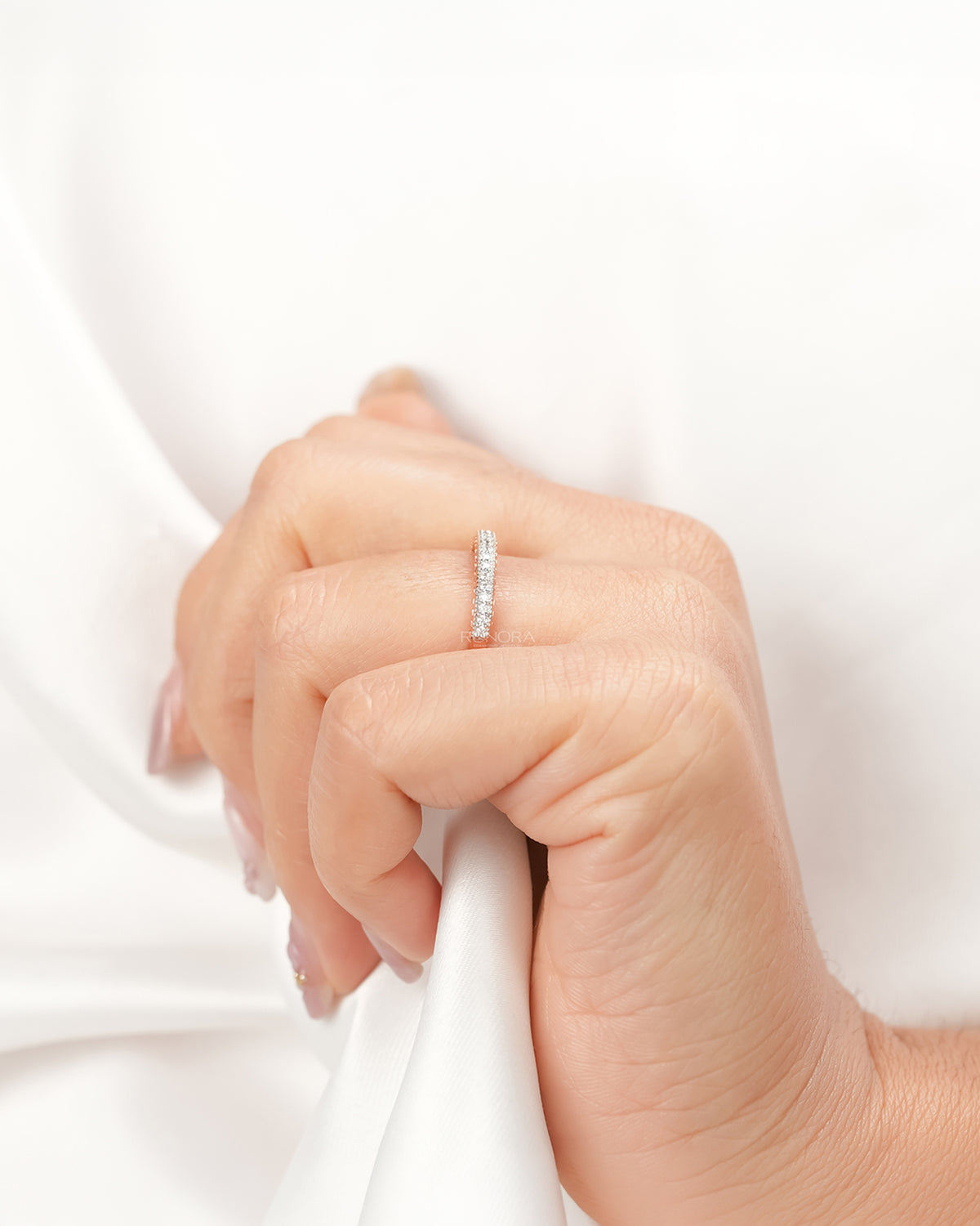 Double-row lab grown diamond pavé band worn with white silk