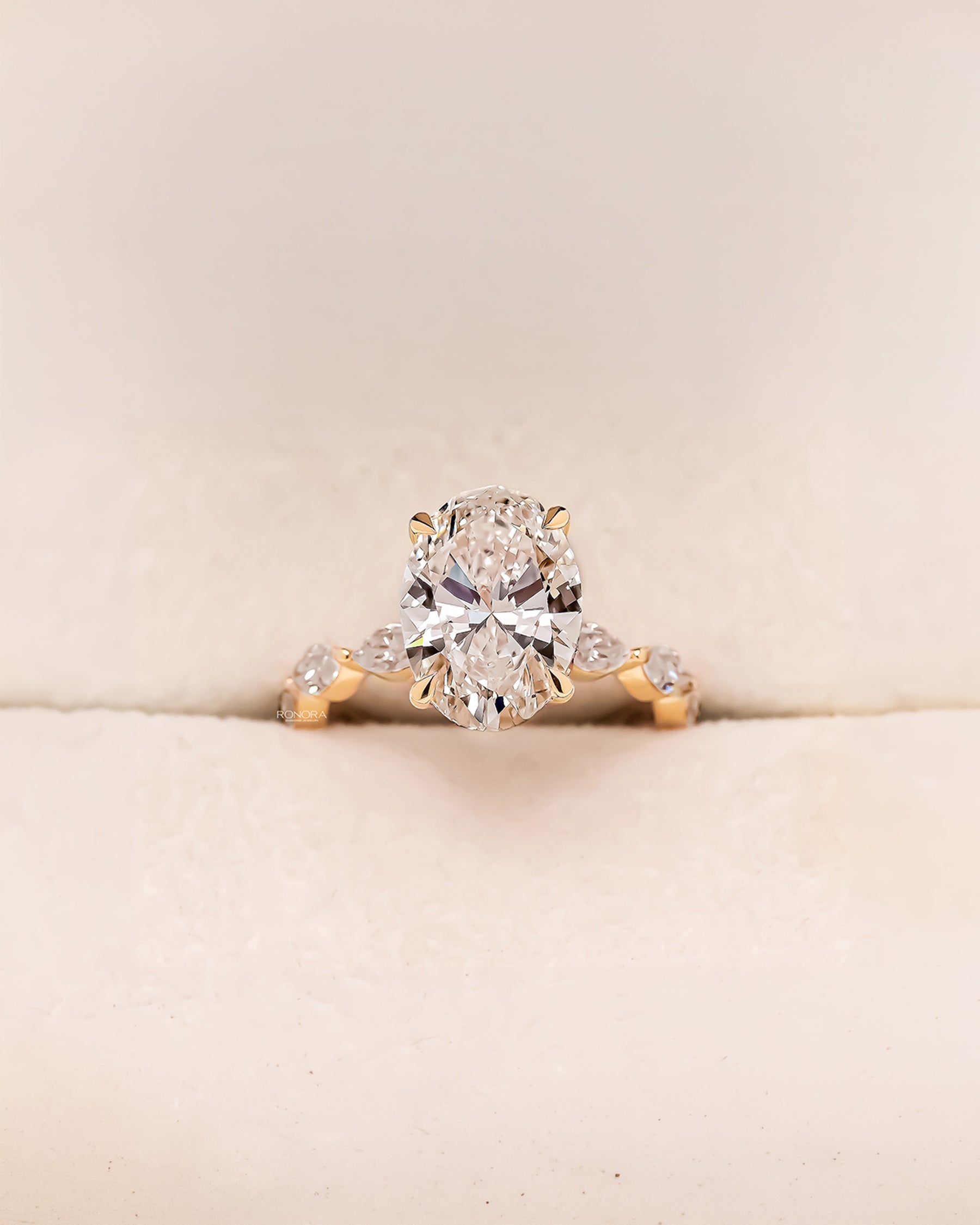 Alessia oval marquise lab grown diamond three-stone ring in yellow gold inside Ronora box
