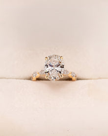 Alessia oval marquise lab grown diamond three-stone ring in yellow gold inside Ronora box