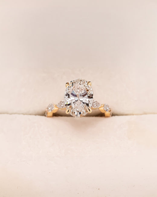 Alessia oval marquise lab grown diamond three-stone ring in yellow gold inside Ronora box