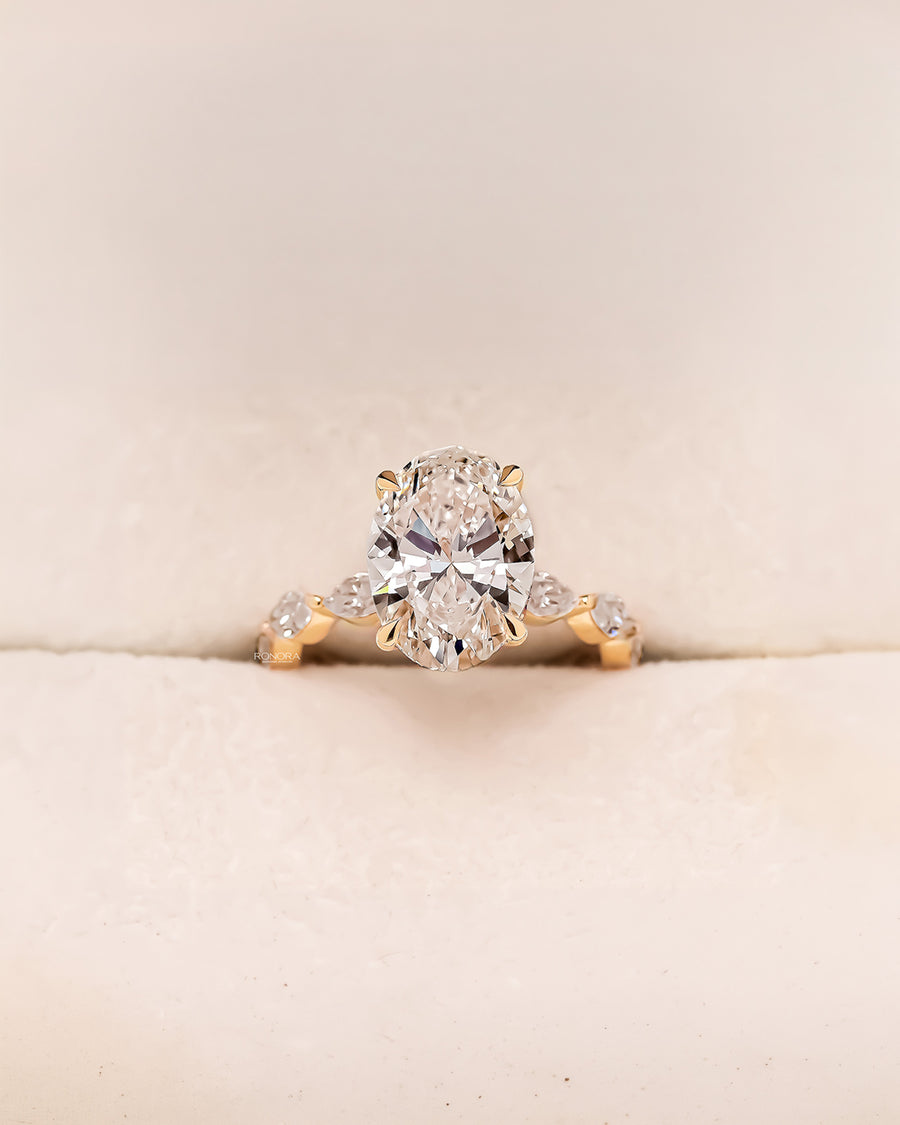 Alessia oval marquise lab grown diamond three-stone ring in yellow gold inside Ronora box