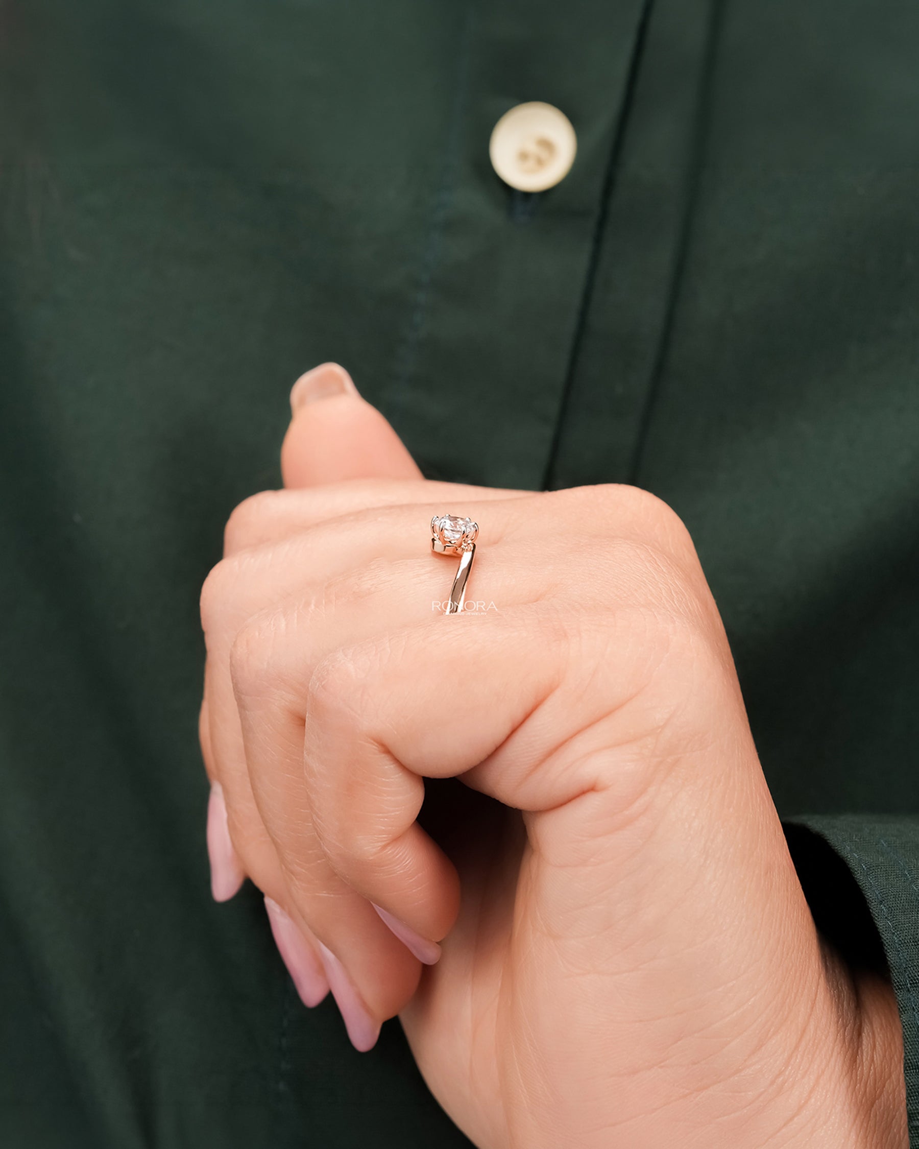 Round lab grown diamond bypass ring worn with white silk