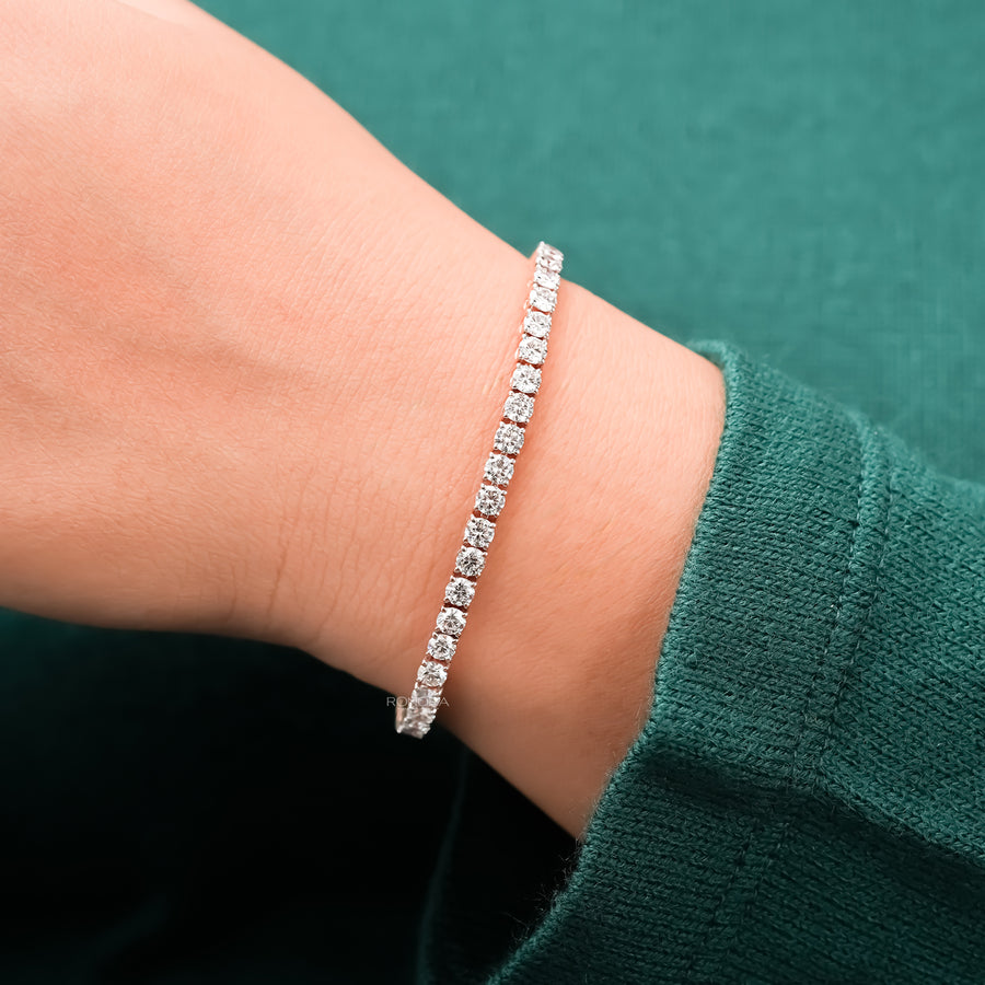 Round lab grown diamond tennis bracelet worn on wrist