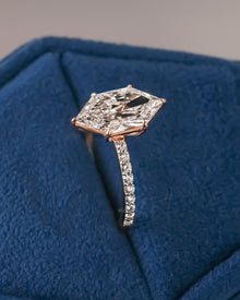 Angled view of marquise lab grown diamond solitaire ring with solitaire pave setting